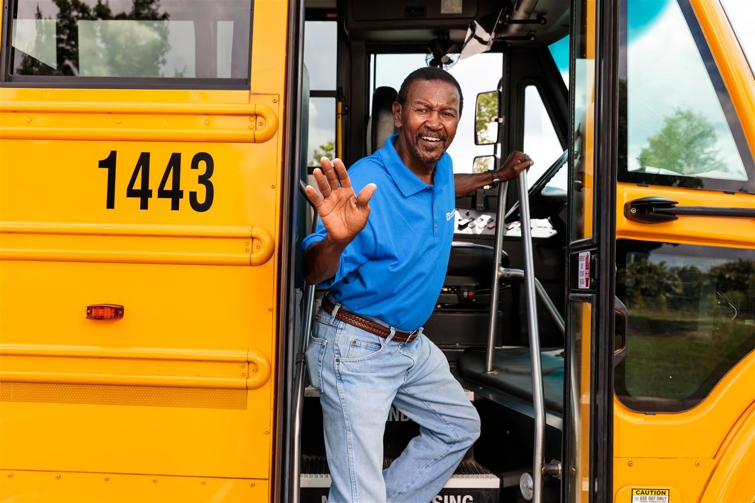 Image of students exiting bus Image of students exiting bus